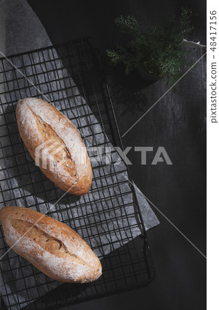 baguette on blue wood table 48417156