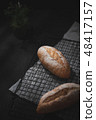 baguette on blue wood table 48417157