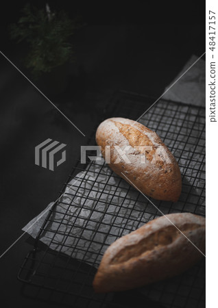 baguette on blue wood table 48417157