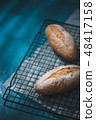 baguette on blue wood table 48417158