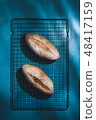 baguette on blue wood table 48417159
