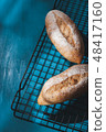 baguette on blue wood table 48417160