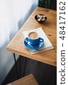 Hot coffee on table with abstract emotion 48417162