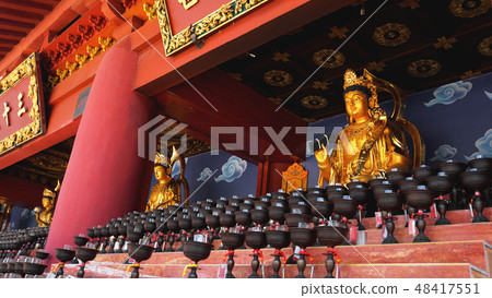 Burning big red candles in Buddhist temple Burning big red candles in Buddhist temple 48417551