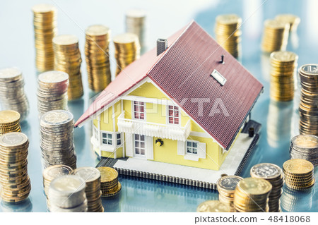 Model familly house with coins as money concept. 48418068