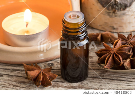 A bottle of star anise essential oil  48418803