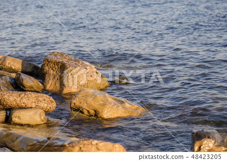Sea waves are fighting against the big rocks on Sea waves are fighting against the big rocks on 48423205