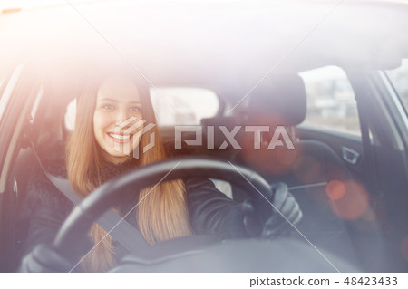 Young lady driving a car in winter 48423433