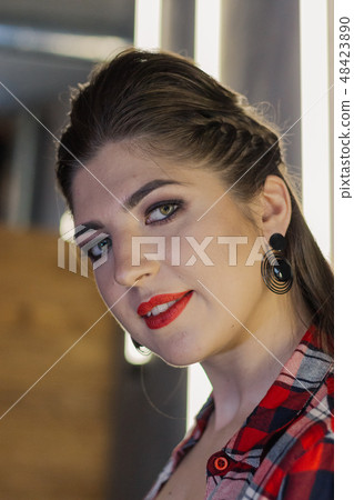 Beautiful and sexy girl posing for a photographer 48423890