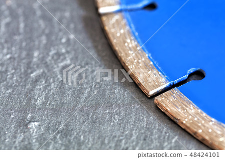 Segment of a diamond cutting disc on a background Segment of a diamond cutting disc on a background 48424101