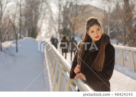 Beautiful and sexy girl posing in winter Beautiful and sexy girl posing in winter 48424143