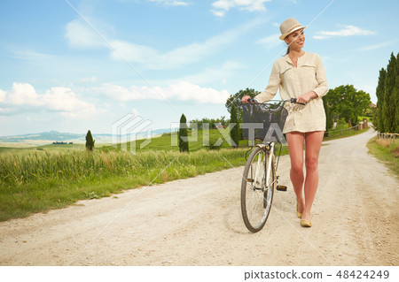 Beautiful vintage girl next to bike, summer Italy time Beautiful vintage girl next to bike, summer Italy time 48424249