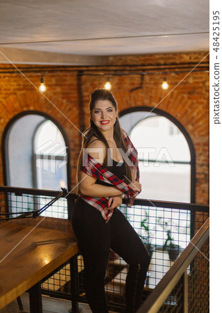 Beautiful and sexy girl posing in a cafe. Loft 48425195