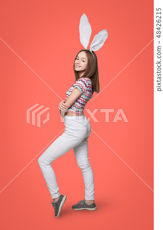 Full length of a girl wearing bunny ears Full length of a girl wearing bunny ears 48426215