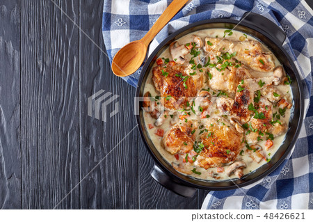 chicken fricassee in a ceramic casserole, flatlay 48426621