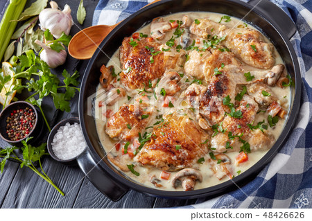 chicken fricassee in a black dutch oven chicken fricassee in a black dutch oven 48426626