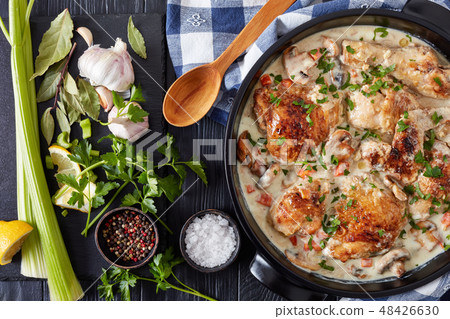 chicken fricassee in a black dutch oven chicken fricassee in a black dutch oven 48426630
