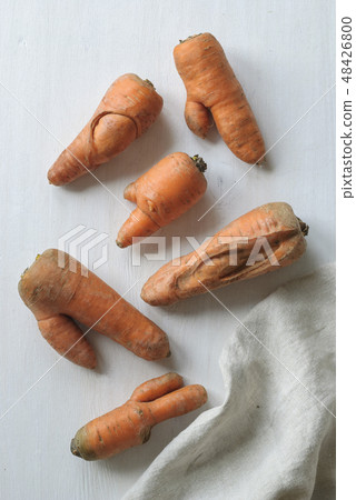 Some ugly carrots of a harvest 48426800