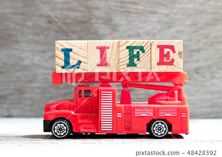 Toy fire truck hold letter block in word life Toy fire truck hold letter block in word life 48428392