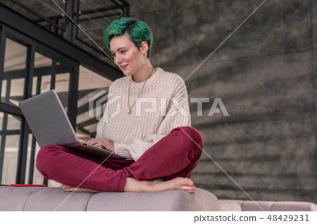 Successful businesswoman typing business letter to her partner Successful businesswoman typing business letter to her partner 48429231