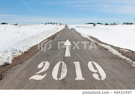 snowy road heading to 2019 48432497