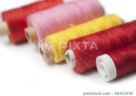 sewing thread spool bobbins on white background sewing thread spool bobbins on white background 48432976