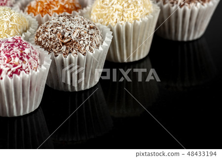 Natural healthy candies black glass background Natural healthy candies black glass background 48433194