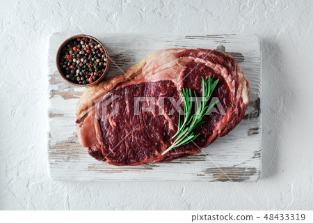 Marbling ribeye steak on white plate Marbling ribeye steak on white plate 48433319
