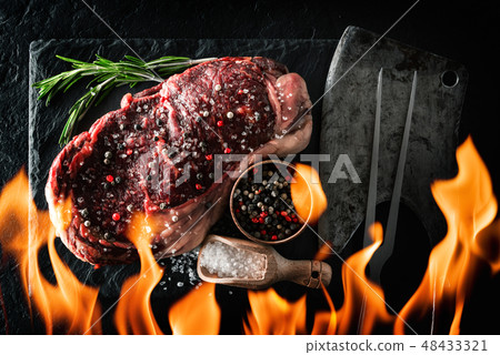 Marbling ribeye steak on black plate 48433321