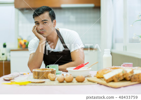 boring husband preparing breakfast boring husband preparing breakfast 48433759