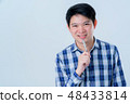 casual relax asian smart man thinking with pen  48433814