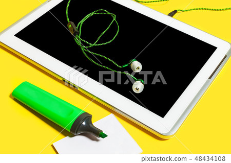 set of office accessories on a yellow surface set of office accessories on a yellow surface 48434108