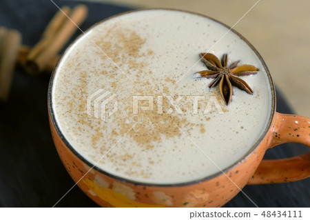 Cup of coffee capuccino with Badian on a tray. Close-up. Cup of coffee capuccino with Badian on a tray. Close-up. 48434111
