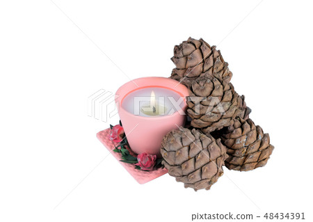 one candle and pine cones on a white background 48434391
