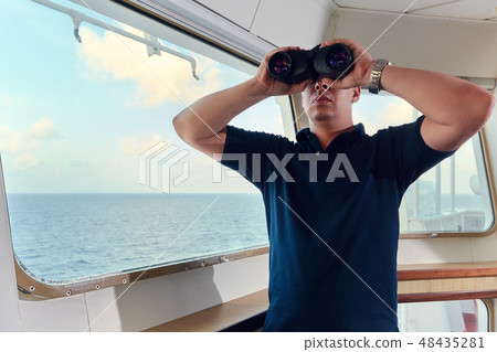 Portrait of navigator pilot officer on the bridge of the vessel 48435281