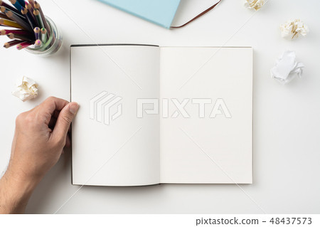 man hand hold brown notebook on white background 48437573