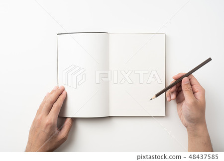 man hand hold brown notebook and pen on white 48437585