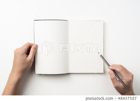 man hand hold brown notebook and pen on white 48437587