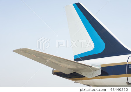 The tail part of the plane with blue sky The tail part of the plane with blue sky 48440230
