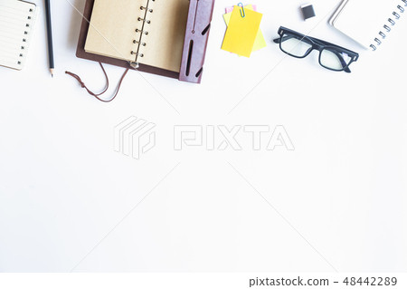 White desk office with laptop, smartphone and othe 48442289