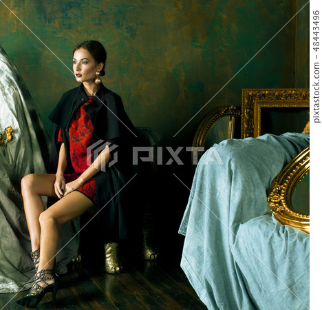 beauty rich brunette woman in luxury interior near empty frames beauty rich brunette woman in luxury interior near empty frames 48443496