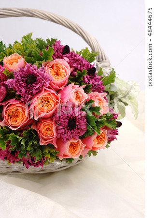 Roses and Ranunculus flower basket 48444675