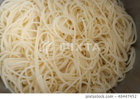 Close up texture of yellow spaghetti Close up texture of yellow spaghetti 48447452