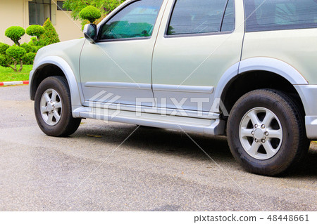 car close up and water drops on road  48448661