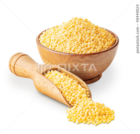 Millet in a wooden bowl with a scoop isolated on white Millet in a wooden bowl with a scoop isolated on white 48449024