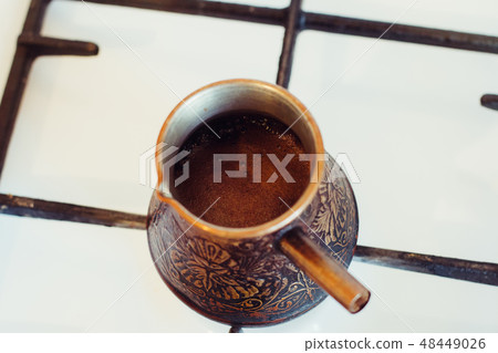 Turka with coffee on the gas stove Turka with coffee on the gas stove 48449026
