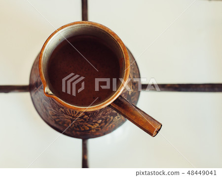 Turka with coffee on the gas stove Turka with coffee on the gas stove 48449041