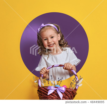 Girl with painted eggs Girl with painted eggs 48449095