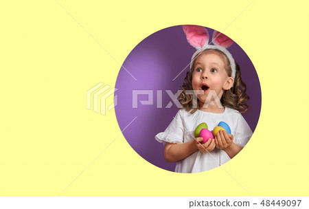Girl with painted eggs 48449097