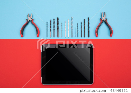 set of metalwork tools with tablet on colorful background set of metalwork tools with tablet on colorful background 48449551